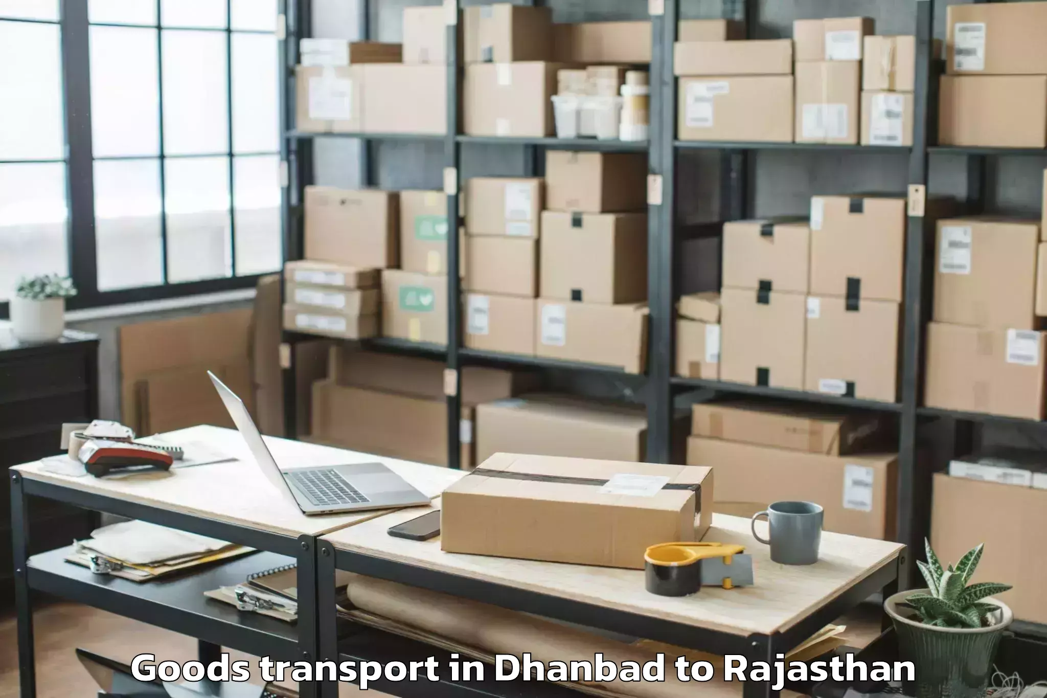 Get Dhanbad to Sanganeer Airport Jai Goods Transport